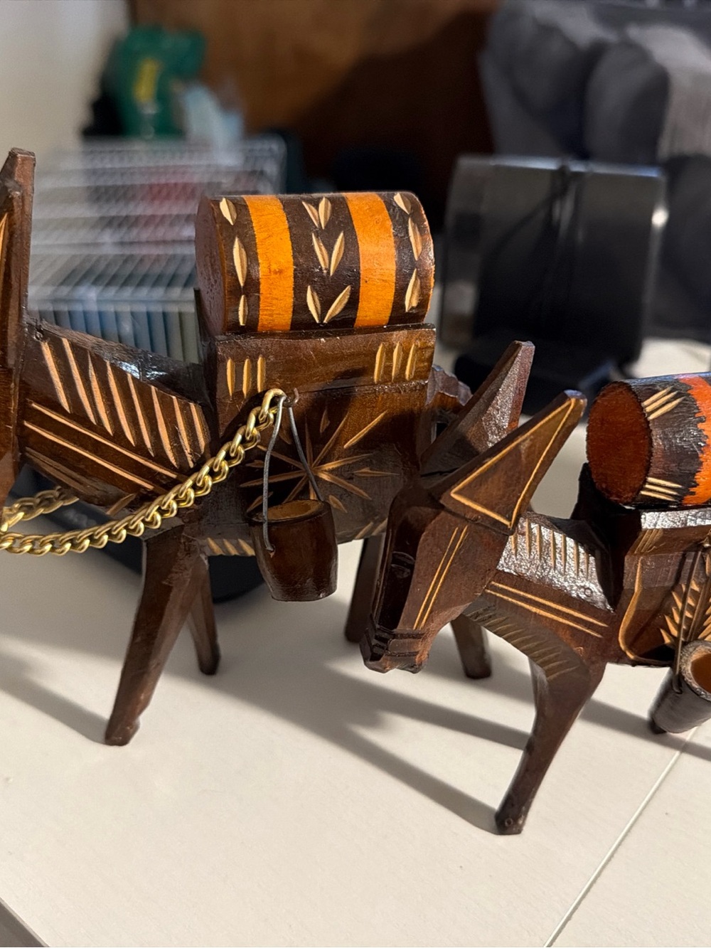 Hand-Carved Wooden Donkey Figurines with Orange Accents